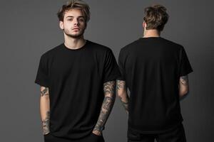 Two men in black t - shirts standing in front of a gray background photo