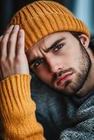 A man in a yellow hat and sweater photo