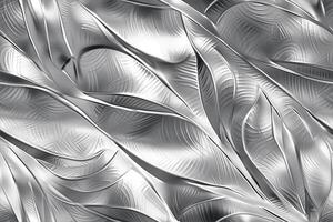 A silver metal texture with leaves and swirls photo