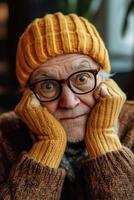 An older man wearing a yellow hat and glasses photo