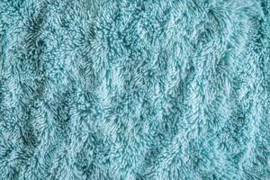 Closeup of a blue shaggy rug photo