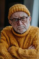 An old man in a yellow sweater and glasses photo