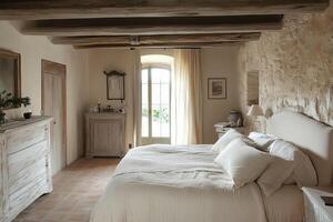A bedroom with stone walls and a bed photo