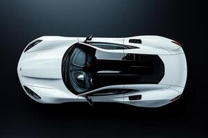 Top view of a white sports car on a black surface photo