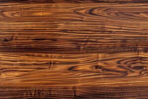 Polished wooden teak surface showcasing rich, dark brown tones with intricate grain patterns. The texture is smooth and glossy, highlighting the natural beauty of the wood. photo