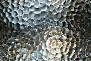 A close up of a glass surface with many different shapes photo