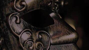 a close up of a mask with a gold design video