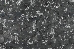 A black and white chalkboard with drawings on it photo