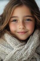 A young girl is wearing a warm sweater photo