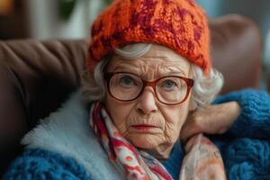 An older woman wearing glasses and a knit hat photo