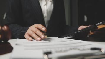 A woman in a suit is signing a document video