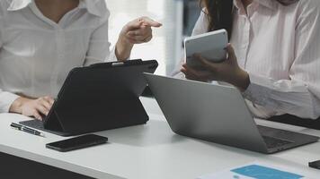 Two businesswomen are working on their laptops video