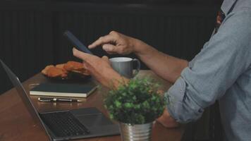 Man using smartphone at desk video