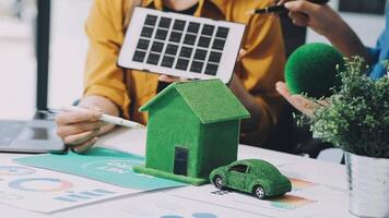Green house with solar panels and car on table video