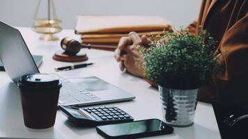 A lawyer's desk with laptop and a judge's gavel video