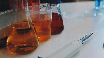 A laboratory with several bottles of liquid video