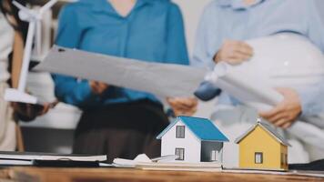 A group of people are working on a house video