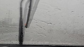 a view of the windshield of a car with rain on it video