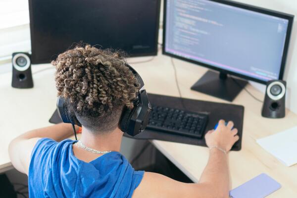 Male programmer working at his desk at home