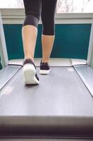 Wpman legs warming up over treadmill in training session photo