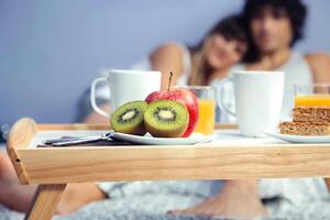 Pieces of fruit in healthy breakfast served on tray photo