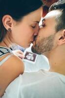 Top view of kissing couple photo
