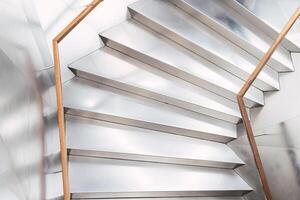 Staircase with railings in corridor photo