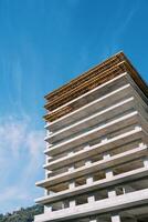 Frame of a multi-storey building under construction in a wooden crate photo