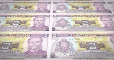 Banknotes of two honduran lempira of Honduras rolling, cash money, loop video