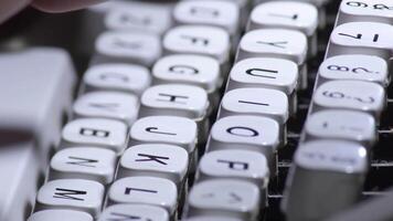Typing in a old qwerty typewriter with white keys video