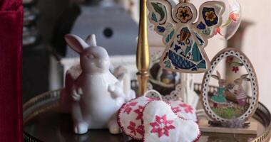 Create a delightful Easter theme with handcrafted Easter decorations that adorn a tiered tray. video