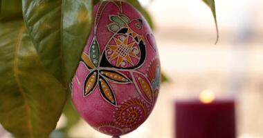 Watch skilled artisans create handcrafted Easter decorations with vibrant dot art on pysanka egg. Discover the intricate designs that add charm to any Easter celebration. video