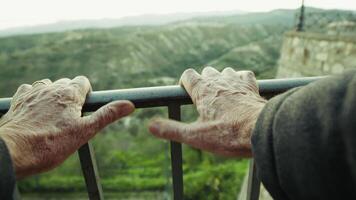 Point Of View Hands Of An Elderly Gentleman Cling To A Railing Overlook Nature video