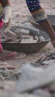 Workers sorting materials at a construction site in warm daylight video