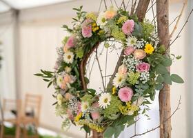 A delicate and elegant wreath of light flowers that conveys purity, romance and a wedding atmosphere photo