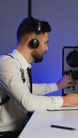 Intelligence officer analyzing intercepted audio and taking notes video