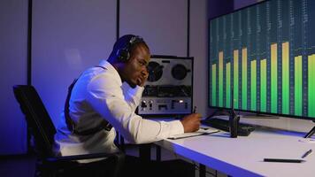 Intelligence officer analyzing audio data and taking notes video