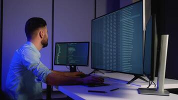 Cybersecurity expert analyzing code and monitoring system logs video