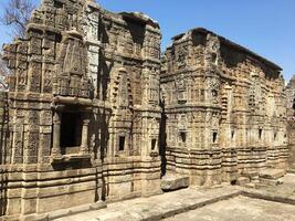 Ancient hindu temple in Kangra fort, Himachal Pradesh, India. Ruins with intricate stone carvings in a historical site. photo