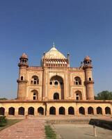 Safdarjung Tomb in Delhi, India. Mughal architecture under a clear blue sky. photo