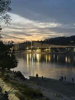 Sunset over Ram Jhula bridge in Rishikesh, India. photo