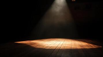 Dramatic spotlight illumination on empty wooden stage in dark theater photo