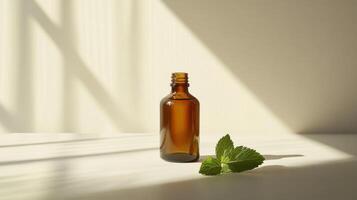 Amber glass bottle with fresh mint leaves in sunlit minimalistic setting photo