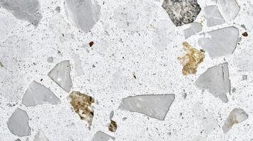 Contemporary white terrazzo surface with marble and stone fragments for modern interiors photo