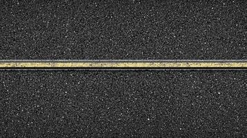 Top view of asphalt road with single yellow line for transportation concept photo