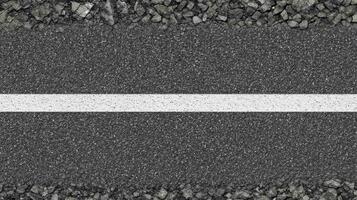 Asphalt road with white line and gravel edges captures urban infrastructure concept photo