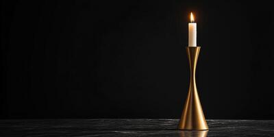 Elegant gold candle holder with burning candle on dark background concept photo