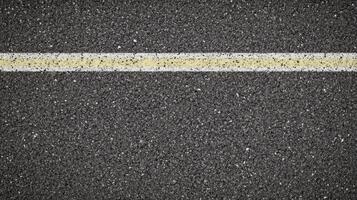 Single white line on asphalt road surface for transportation concept photo
