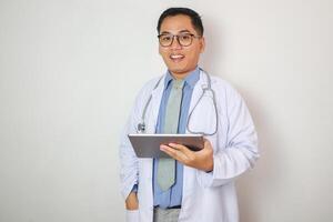 Medical Research Laboratory Portrait of a Handsome Male Scientist Using Digital Tablet Computer to Analyse Data. Advanced Scientific Lab for Medicine, Biotechnology, Microbiology Development photo