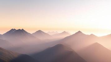 The mountains are covered in a misty haze, creating a serene and peaceful atmosphere. The sun is setting, casting a warm glow over the landscape. The mountains are tall and majestic photo